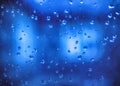 Blue waterdrops on window Royalty Free Stock Photo