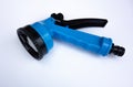 Blue watering adapter for garden hose on a white background Royalty Free Stock Photo