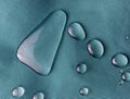Blue waterproof fabric with raindrops close-up Royalty Free Stock Photo