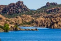 Blue Waters Of Foothills Lake With Boulder Shoreline