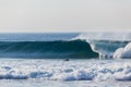 Blue Wave Wall Crashing Surfer Paddling Royalty Free Stock Photo