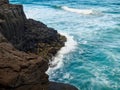 Blue Waves crashing headland