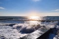 Blue waves crashing on a rocky shore Royalty Free Stock Photo