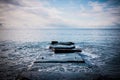 Blue waves crashing on a rocky shore Royalty Free Stock Photo