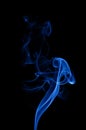 Blue waves of smoke on the black background.