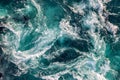 Blue waves of water of the river and the sea meet each other during high tide and low tide