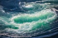 Blue waves of water of the river and the sea meet each other during high tide and low tide Royalty Free Stock Photo