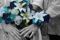 Colored flowers on black and white hands