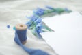 Blue wedding invitation mockup card decorated with silk ribbon, crystals and bride wreath. Diffuse soft focus Royalty Free Stock Photo