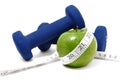 Blue Weights, Green Apple, and Tape Measure Royalty Free Stock Photo