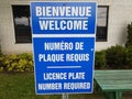 Blue welcome license plate number required in French and English
