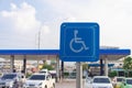 Blue wheel chair sign in gas station Royalty Free Stock Photo