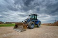 Blue Wheel loader on a construction site, mining