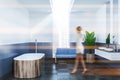Blue and white bathroom interior, wooden tub blur Royalty Free Stock Photo