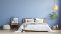 a blue and white bedroom with white bedding and pillows Royalty Free Stock Photo