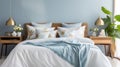 a blue and white bedroom with white bedding and pillows Royalty Free Stock Photo