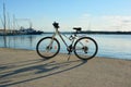 Blue and white bicycle of the HEAD company parked near the sea. Sarafovo fishing port near Burgas