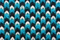 Blue, white and black pattern of synthetic knitted fabric texture Royalty Free Stock Photo