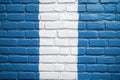 A blue and white brick wall with a distinctive white stripe, suitable for use in design concepts or as a background Royalty Free Stock Photo