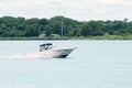 blue and white cabin cruiser on the st Clair river Royalty Free Stock Photo