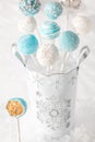 Blue and white cake pops with bite out