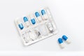 Blue and white capsules pill in blister pack . Global healthcare concept. Antibiotics drug resistance. Antimicrobial capsule pills Royalty Free Stock Photo