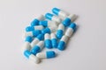 Blue and white capsules in the studio Royalty Free Stock Photo