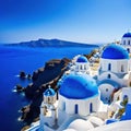 a blue and white church on a cliff overlooking the ocean and a blue dome with a cross on roof and a bell