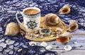 Blue and white cup of coffee, sea shells, compass, blue fishing net. Vacation at sea