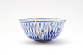 Blue and white decorated bowl repaired with the antique kintsugi real gold technique Royalty Free Stock Photo