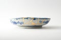 Blue and white decorated plate repaired with the antique kintsugi real gold technique Royalty Free Stock Photo