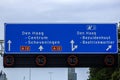 Blue and white direction sign on Motorway A12