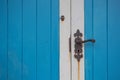 Blue and white door with old doorhandle Royalty Free Stock Photo