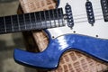 Blue White Electric Guitar. Electric guitar close-up with selective focus. A Part Of Electric Guitar Royalty Free Stock Photo