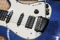 Blue White Electric Guitar. Electric guitar close-up with selective focus. A Part Of Electric Guitar Royalty Free Stock Photo