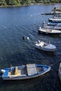 Blue and white fishing boats over dark water. Ston, Croatia Royalty Free Stock Photo