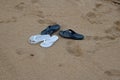 BLUE AND WHITE FLIPFLOPS ON THE SAND Royalty Free Stock Photo