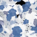 Blue, white, gray and black watercolor stains and specks overlap each other. Delicate light background. Royalty Free Stock Photo