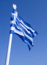 The blue and white Greek flag fly against blue sky Royalty Free Stock Photo