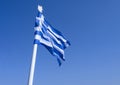 The blue and white Greek flag fly against the blue sky Royalty Free Stock Photo