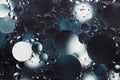 Blue, white and grey tones oil with water round different sizes bubbles macro Royalty Free Stock Photo