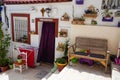 Blue and white houses in typical street in Barrio Santa Cruz in Alicante, Costa Blanca, Spain