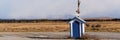 Blue And White Hut Standing Alone On Side Of Highway Royalty Free Stock Photo