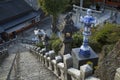 Blue and white lanterns near the stairs of the Tozan shrine in Arita at dusk