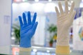 Blue and white latex gloves