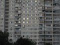 Blue and white multi-storey apartment building in a residential area