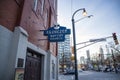 the blue and white neon sign over the red brick Ebenezer Baptist Church with skyscrapers and office building in the city skyline Royalty Free Stock Photo