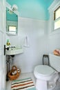 Blue and white old bright small bathroom. Royalty Free Stock Photo
