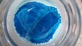 Blue and white paint mix with bubbles and bulges 2