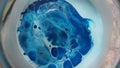 Blue and white paint mix with bubbles and bulges 1